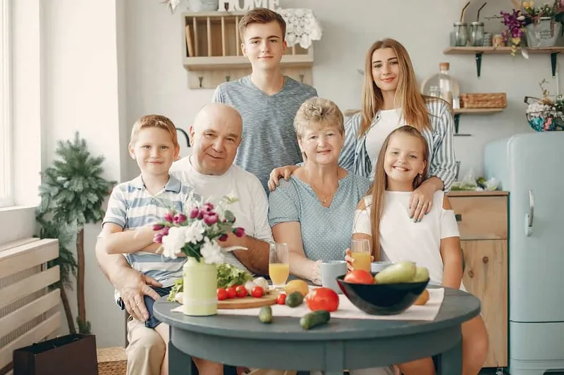 A family of three generations around a kitchen table
